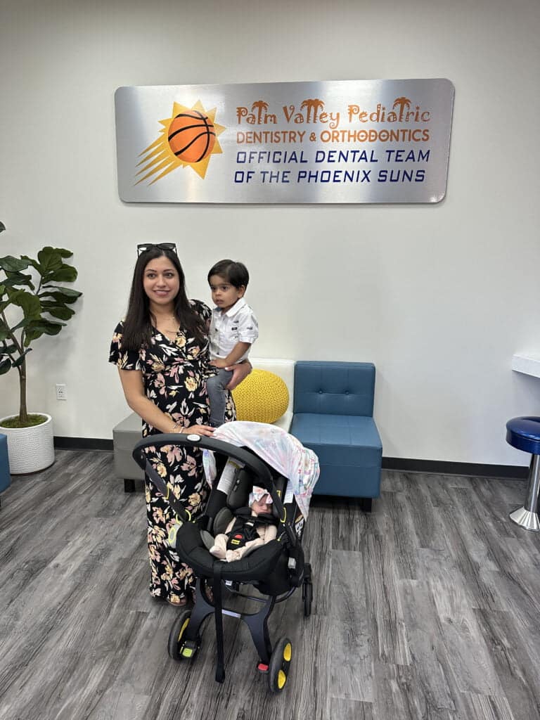 Mother and baby smiling at Palm Valley Pediatric Dentistry, Scottsdale for first dental visit